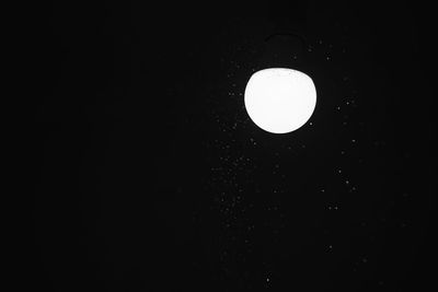 Low angle view of moon against sky at night