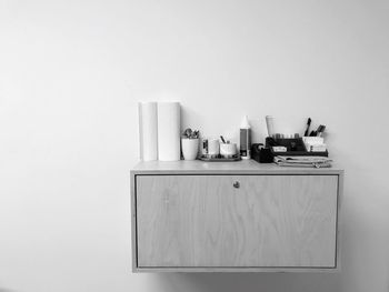 Close-up of objects on table against white background