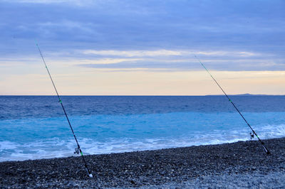 Fishing rods at calm beach