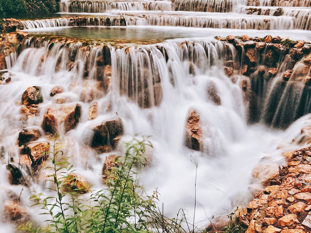 waterfall, water, scenics - nature, beauty in nature, nature, motion, water feature, environment, long exposure, travel destinations, plant, flowing water, flowing, rock, body of water, no people, tourism, travel, land, watercourse, tree, river, outdoors, autumn, forest, blurred motion, day, landscape, architecture
