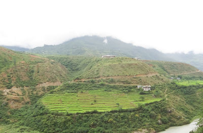Scenic view of agricultural field and mountains