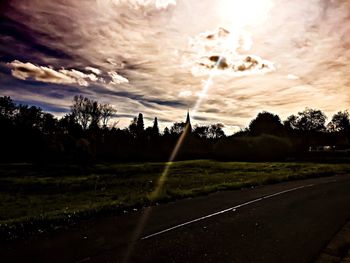 Scenic view of landscape against cloudy sky