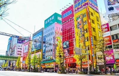 Low angle view of buildings in city against sky