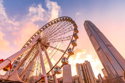 Low angle view of ferris wheel against sky