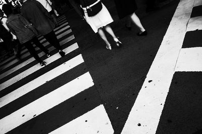 Low section of people crossing road