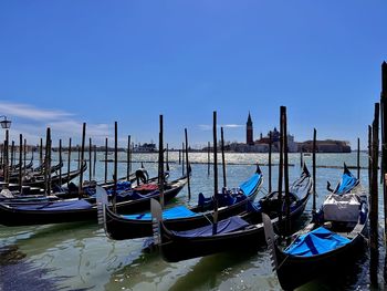 Boats moored at harbor