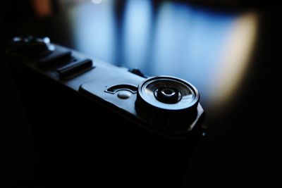 Close-up of retro camera on table