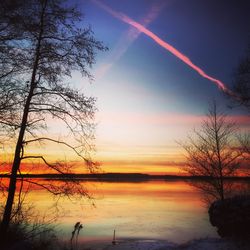 Scenic view of sunset over river