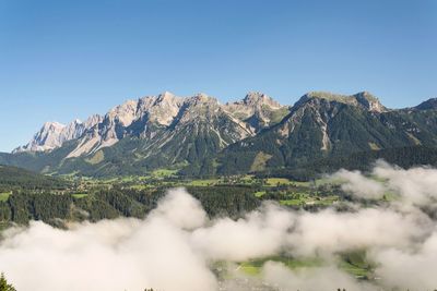 Scenic view of mountains against clear blue sky