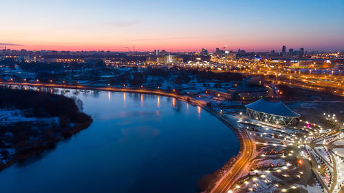 River and city lights early in the morning. sunrise minsk belarus. shooting a quadcopter.