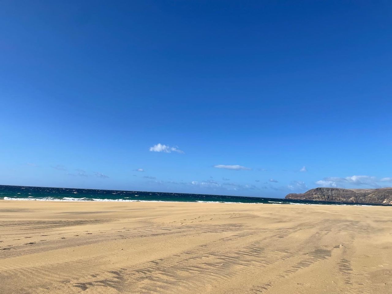 land, sky, sand, natural environment, scenics - nature, environment, landscape, blue, nature, horizon, beach, beauty in nature, sea, water, tranquility, clear sky, tranquil scene, travel destinations, desert, travel, dune, no people, sand dune, non-urban scene, day, sunny, tourism, outdoors, cloud, sunlight, copy space, coast, trip, ocean, vacation, holiday, animal wildlife, shore, arid climate