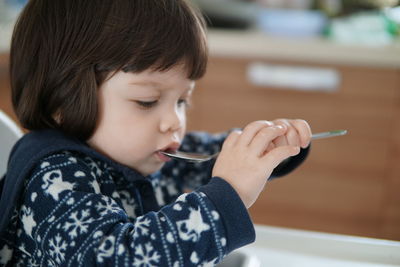 Close-up portrait of boy looking at camera