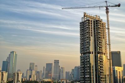 Modern buildings against sky in city