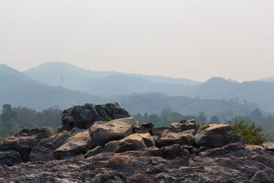 Rocks on mountain against sky