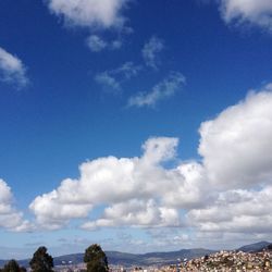 Scenic view of landscape against blue sky