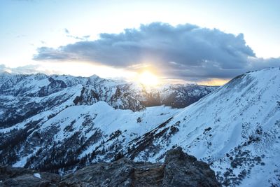 Scenic view of snow covered mountains against sky