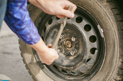 Low section of person with high angle view of car