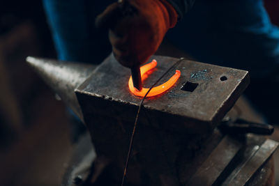 Midsection of man working in workshop