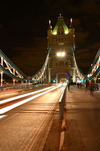 Light trails on suspension bridge at night