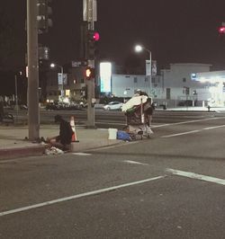 View of illuminated street lights at night