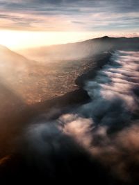 Aerial view of landscape against sky during sunset