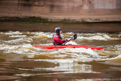 Full length of man on boat in river