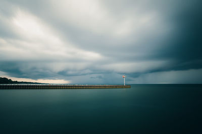 Scenic view of sea against sky at dusk