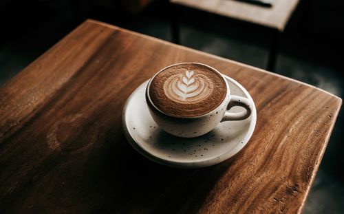 Close-up of coffee cup on table