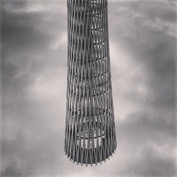 sky, low angle view, cloud - sky, cloudy, cloud, metal, overcast, weather, metallic, day, pattern, built structure, outdoors, no people, nature, tall - high, tranquility, architecture, dusk, pole