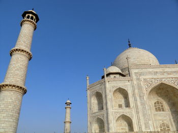 Low angle view of ataj mahal historic building against clear blue sky