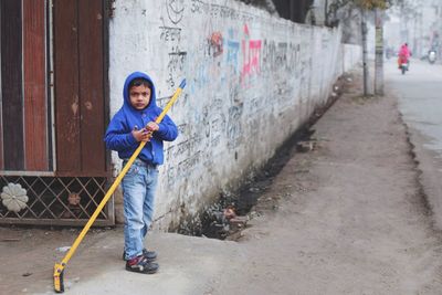 Portrait of boy standing outdoors