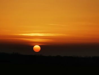 Scenic view of silhouette landscape against romantic sky at sunset