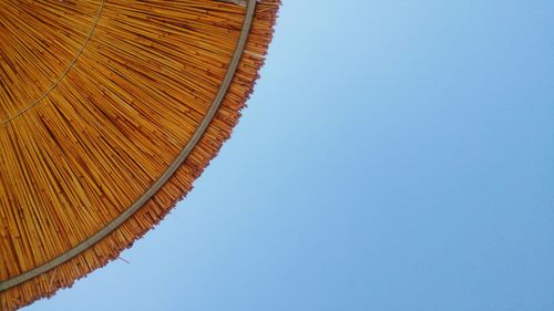 Low angle view of roof against clear blue sky