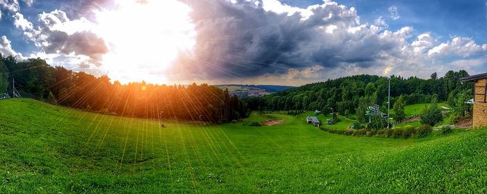 Panoramic view of field against sky