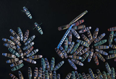 High angle view of ferris wheel against black background