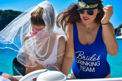 Friends wearing sunglasses at beach