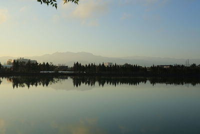 Scenic view of lake against sky during sunset