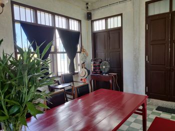 Chairs and table by window at home
