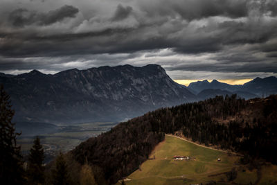 Scenic view of mountains against cloudy sky