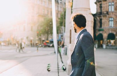 Man looking at city street