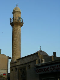 Low angle view of clock tower against sky