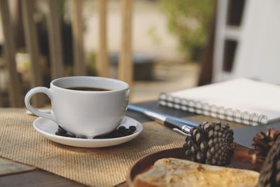 Close-up of coffee cup on table