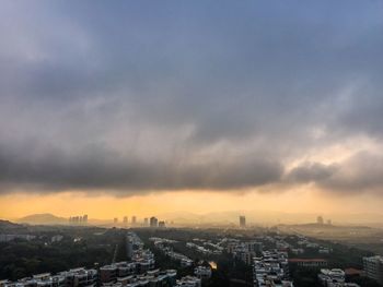 Cityscape against sky during sunset