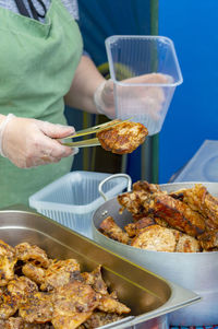 Midsection of person preparing food on table