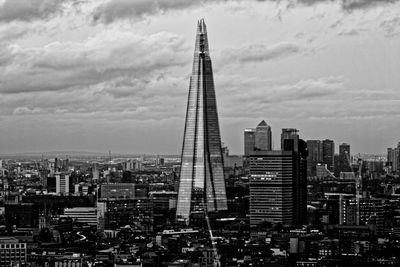 City skyline against cloudy sky