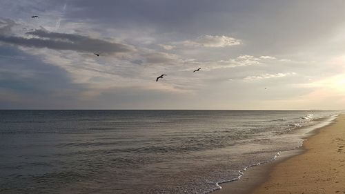 Scenic view of sea against sky at sunset