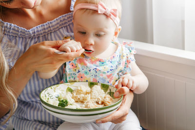 Close-up of girl eating food