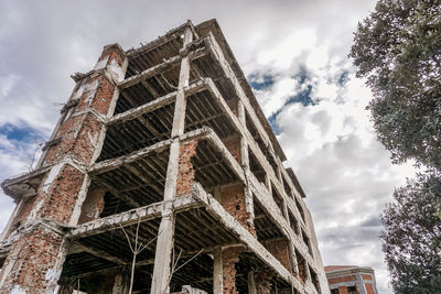 Low angle view of old building against sky