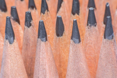 Full frame shot of multi colored pencils in row