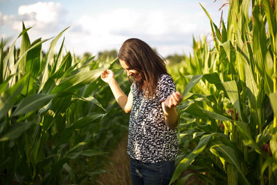 Woman standing in agricultural field